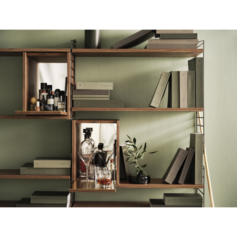 The Tiny Cabinet from String Furniture in a living room.