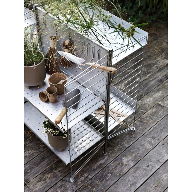 The Upright Galvanized from String Furniture outdoors.