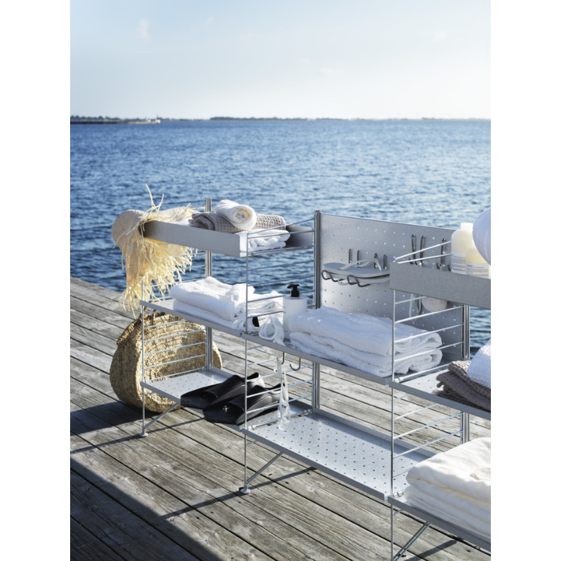 The Vertical Double Hook from String Furniture beside a lake, water front.