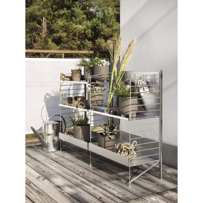 The Vertical Double Hook from String Furniture in an outdoor lounge.