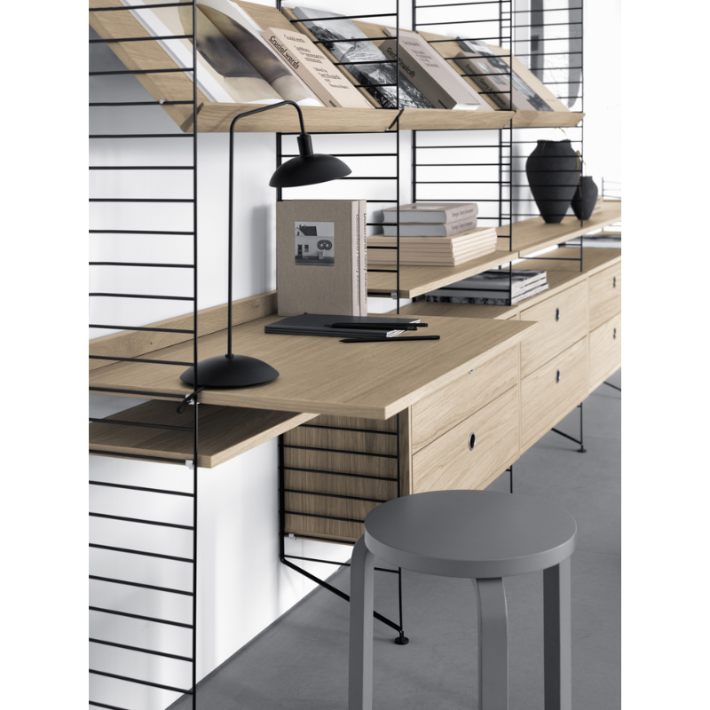 The Work Desk from String Furniture in a family space.