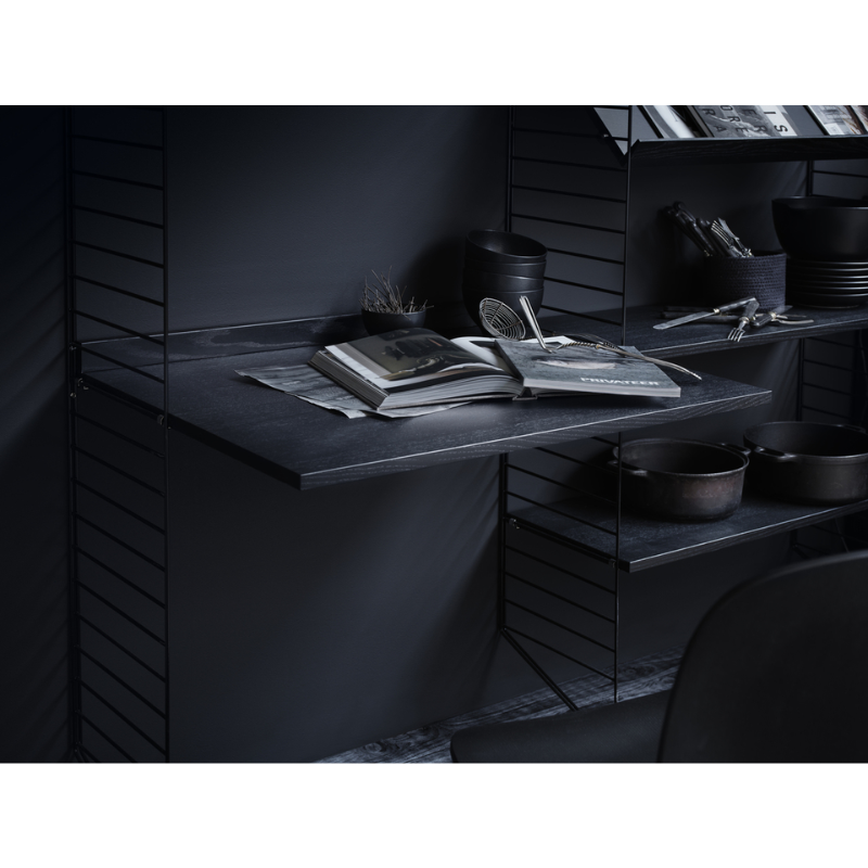 The Work Desk from String Furniture in a kitchen and dining space.