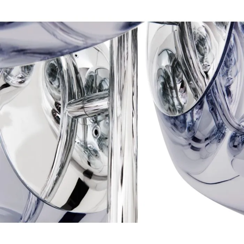 A swarm, huddle, herd, cluster or bunch; there are a thousand ways of configuring our lamps to produce an extraordinary lighting arrangement. The latest additions to Tom Dixon's Melt family includes the Melt Small Chandelier, featuring four orbs protruding from polished tubes and measuring one meter high. Fitted with their new LED module, Tom Dixon's Melt Chandeliers are an attempt to rethink the contemporary chandelier.