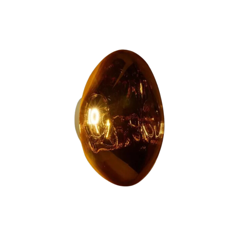 Tom Dixon's Melt LED Surface Wall Sconce is a beautifully distorted pendant in collection of modern finishes with matching ceiling rose. Featuring an integrated LED module, this ceiling light creates a mesmerizing melting hot-blown glass effect when turned on, and a mirror-finish effect when off. This piece is made in Germany using a high tech manufacturing techniques to achieve the perfect melted orb for your design.