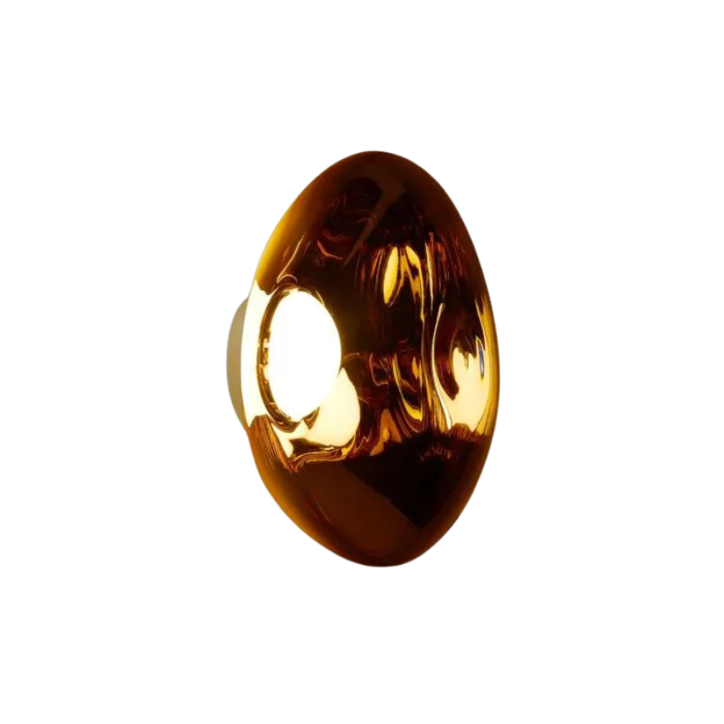 Tom Dixon's Melt LED Surface Wall Sconce is a beautifully distorted pendant in collection of modern finishes with matching ceiling rose. Featuring an integrated LED module, this ceiling light creates a mesmerizing melting hot-blown glass effect when turned on, and a mirror-finish effect when off. This piece is made in Germany using a high tech manufacturing techniques to achieve the perfect melted orb for your design.