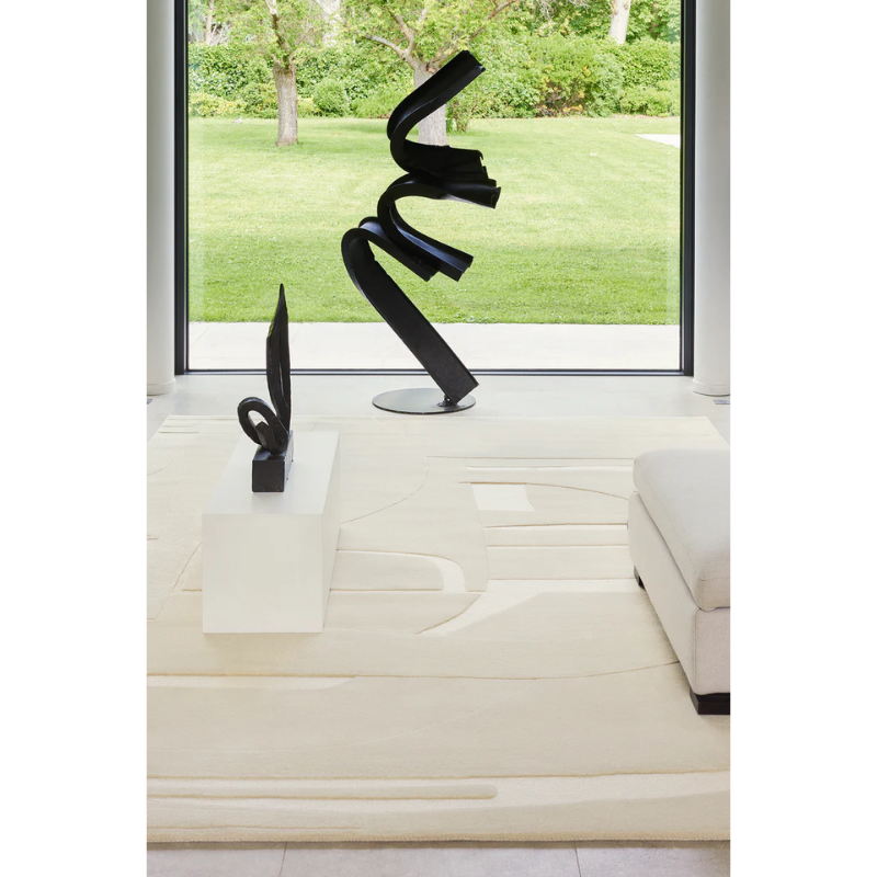 The Collage Wool Rug from Toulemonde Bochart in a living area.