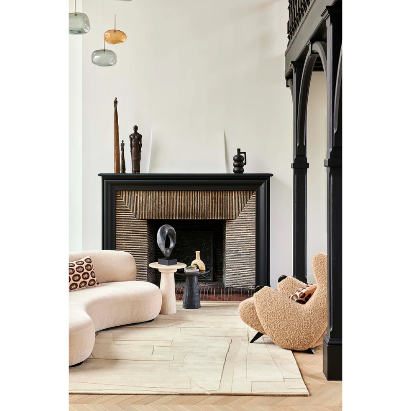 The Collage Wool Rug from Toulemonde Bochart in a living room.