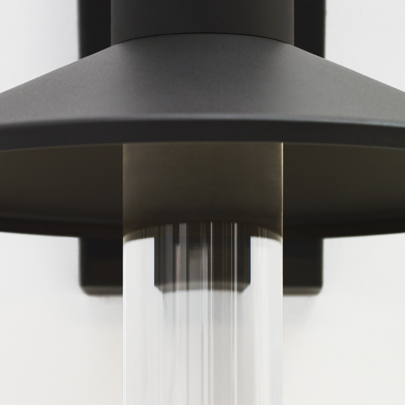 The Ash Cylinder Outdoor Wall Sconce from Visual Comfort and Co. in a studio close up shot.