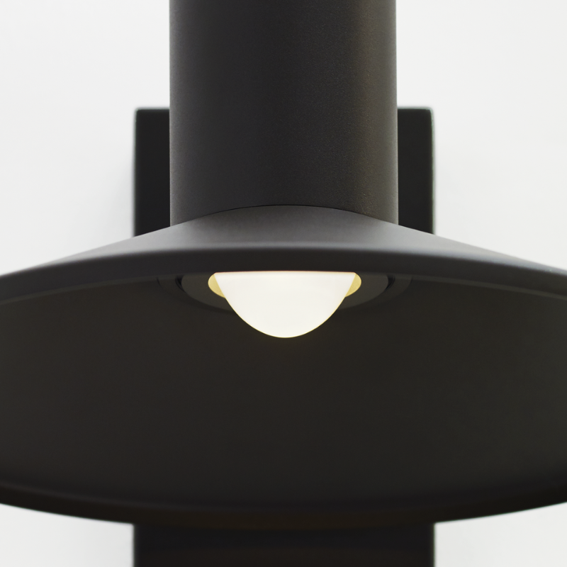 The Ash Dome Outdoor Wall Sconce from Visual Comfort and Co. in a studio close up shot.