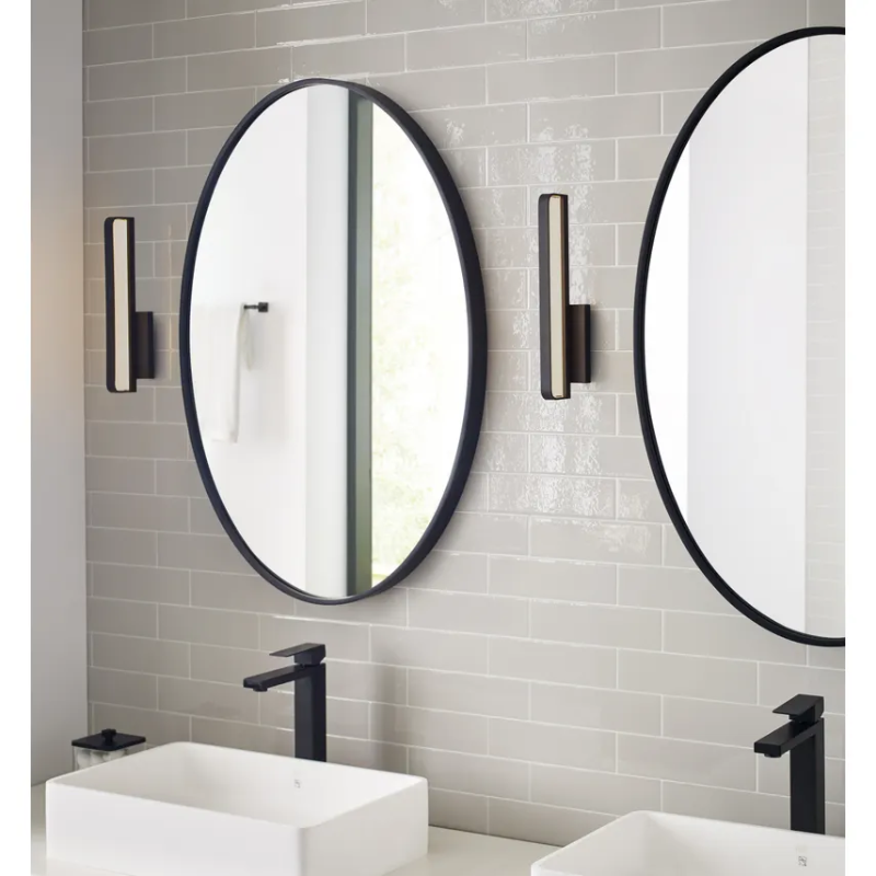 The Banda Vertical Wall Sconce from Visual Comfort & Co. in a bathroom.