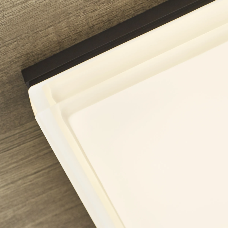 The Boxie Outdoor Wall Sconce from Visual Comfort and Co in a close up lifestyle photograph of the LED fixture.