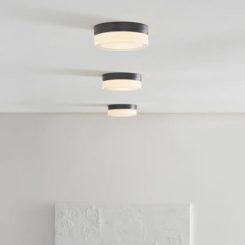 The Cirque Flush Mount from Visual Comfort and Co in a living room.