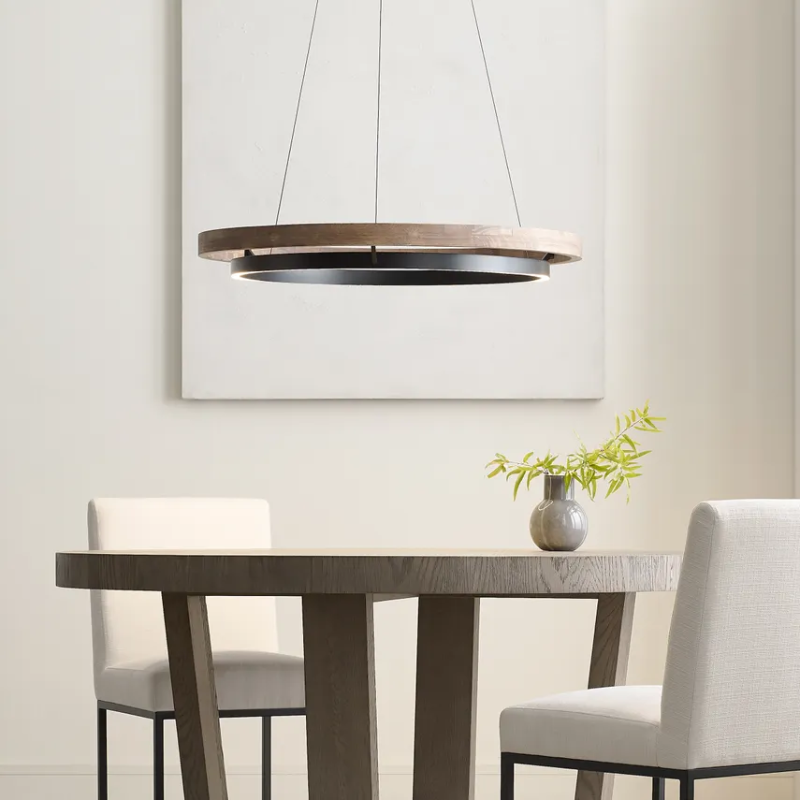 The Grace Chandelier by Sean Lavin is designed with two rings that illuminate this contemporary chandelier. A large outer ring provides organic texture while complemented by a decorative inner ring, housing gently diffused upward and downward LEDs.