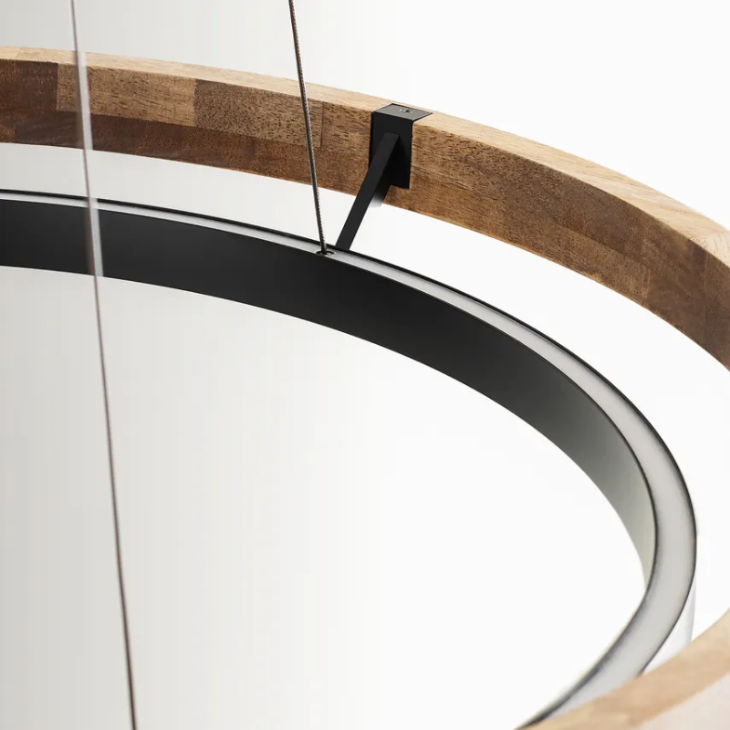 The Grace Chandelier by Sean Lavin is designed with two rings that illuminate this contemporary chandelier. A large outer ring provides organic texture while complemented by a decorative inner ring, housing gently diffused upward and downward LEDs.