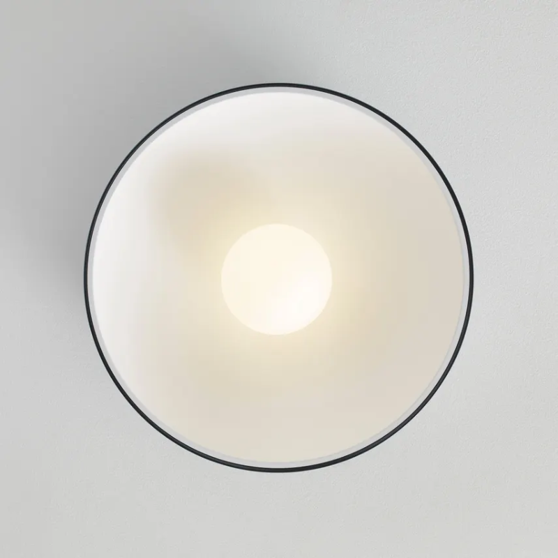 The Joni Flush Mount from Visual Comfort and Co in a lounge.