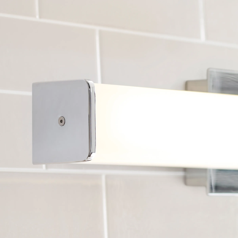 The Lynn Bathroom Sconce from Visual Comfort and Co in a detailed lifestyle photograph.