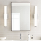The Lynn Bathroom Sconce from Visual Comfort and Co in a home washroom.