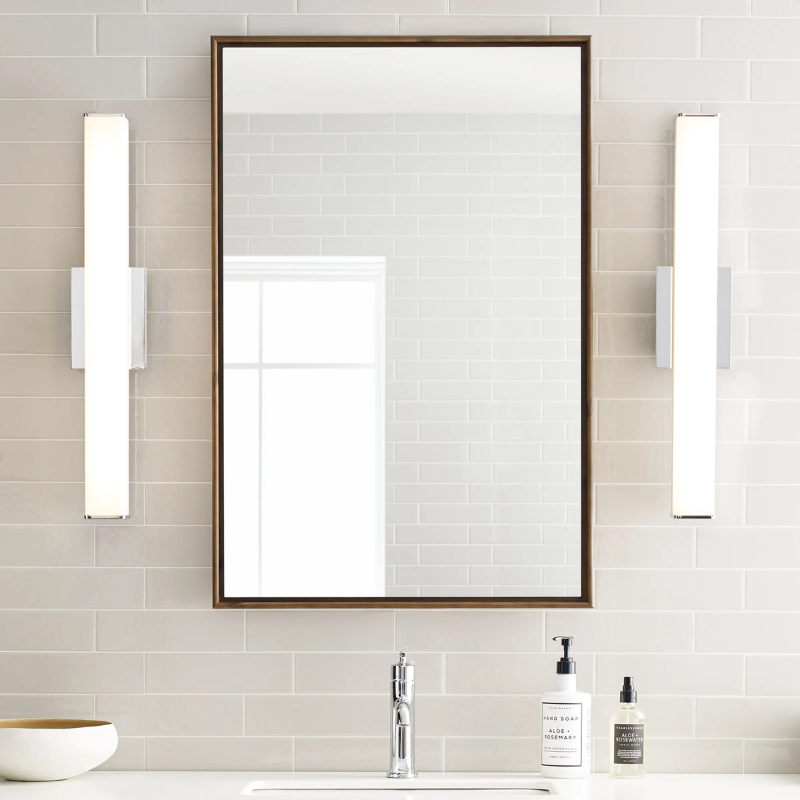 The Lynn Bathroom Sconce from Visual Comfort and Co in a home washroom.