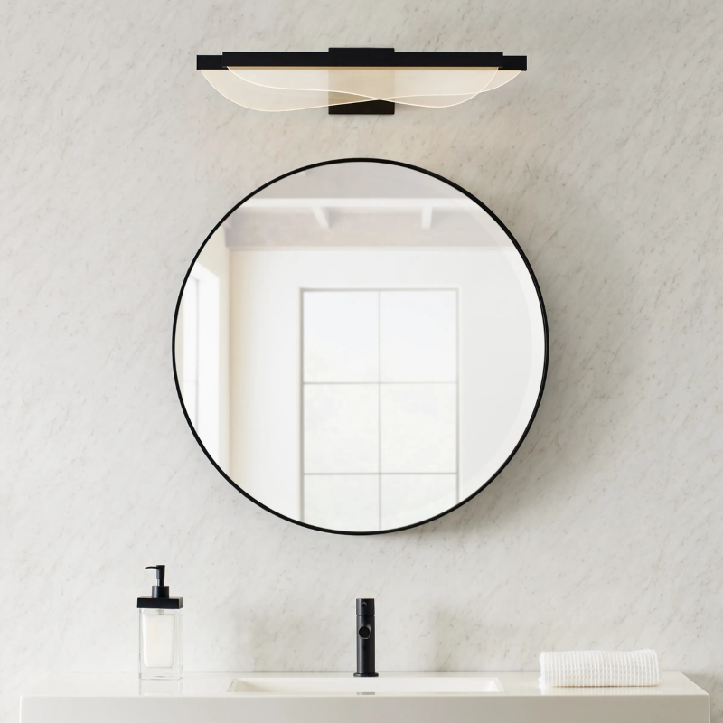 The Nyra Bathroom Sconce from Visual Comfort and Co in a home lifestyle photograph.