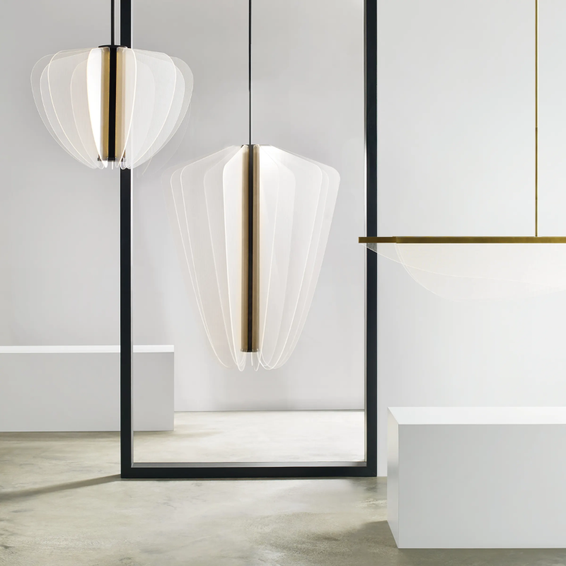 The Nyra Linear Suspension from Visual Comfort and Co in a living room.