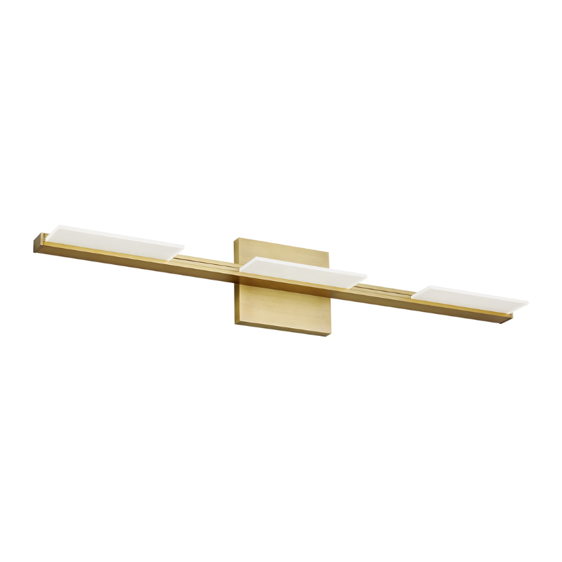 The Tris 3-Light Bathroom Sconce from Visual Comfort and Co in aged brass.
