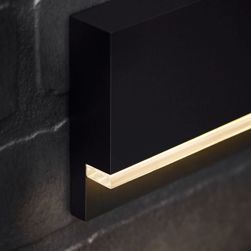 The Wend Outdoor Step Light from Visual Comfort and Co in a lounge.