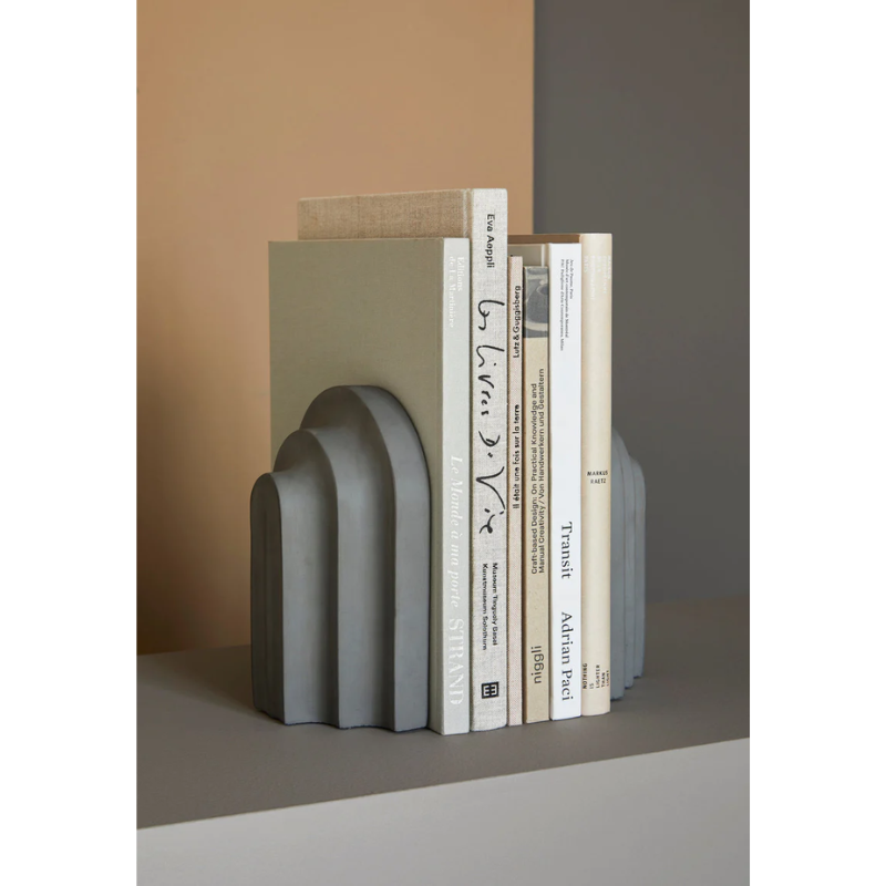 Together with a row of books Arkiv forms a small graphic ensemble of arches and blocks. Inspired by the function and aesthetic of the classic architectural arches and columns. With its vivid shape, the bookend catches the light and throws harmonious shadows revealing a fascinating and delightful piece to the eye. Lean your favourite books against Arkiv, lay it horizontal to function as a paper press or use it as a decorative piece of art.