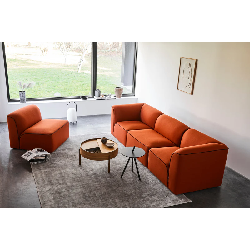 The Come Here Side Table from Woud in Black within a living room with other Woud products.