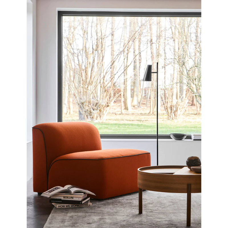 The Cono Floor Lamp from Woud in a lounge.