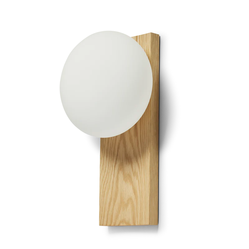 With its portable character, the versatile piece functions as a dynamic table and wall lamp. At the same time, its dimmable feature allows you to change the mood and intensity of the light to suit the specific setting. Place it on a desk, use the tray for your pieces of jewelry or hang it on the wall to provide an inviting light with no need for an electrical supply.