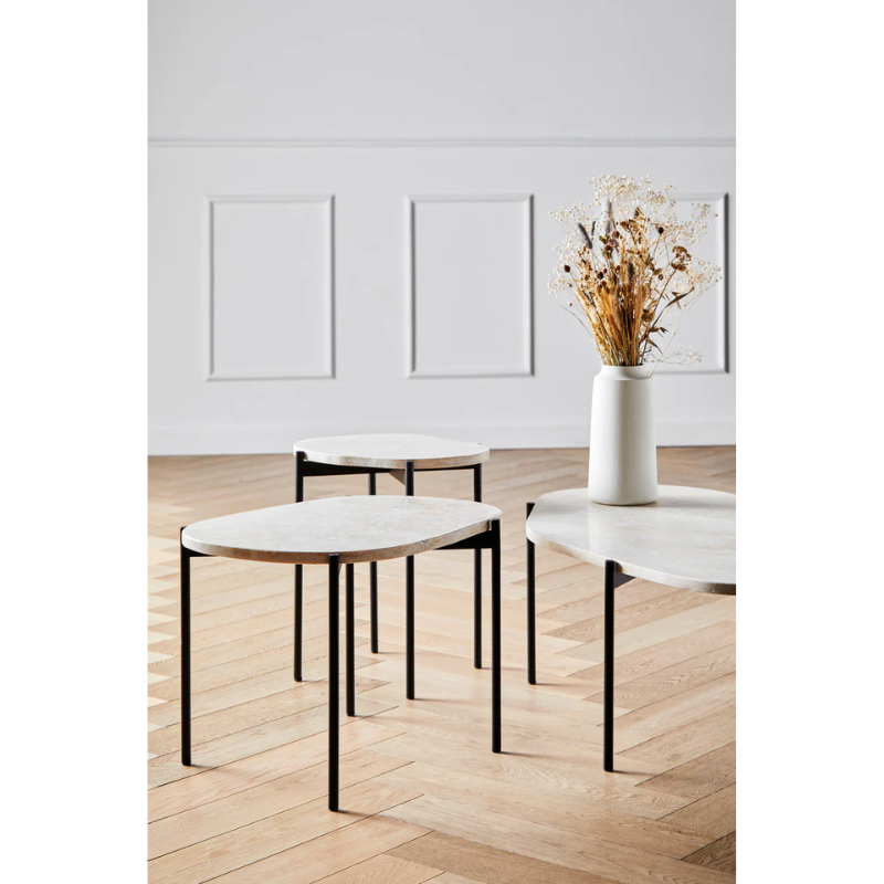 Made from travertine, every surface is unique as the play of colors varies in the natural material. With three different available sizes and heights, the table can be placed as a single piece or entire landscapes can be created.