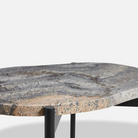 A close up on the Melange La Terra Occasional Table from Woud.