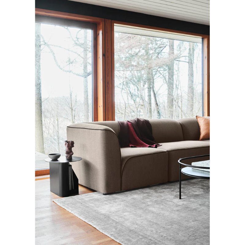 The Sentrum side table follows the principle of simplicity as it has been stripped from all unnecessary elements. What is left is a strong base and geometrical expression with pure functionalities. The S-shaped construction makes the center of attention and creates two spaces for storage on both sides to enhance the usability of the side table - ideal for magazines and books.