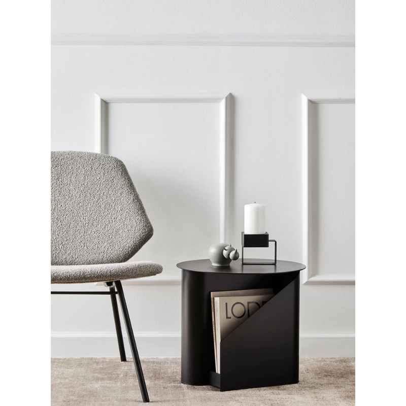The Sentrum side table follows the principle of simplicity as it has been stripped from all unnecessary elements. What is left is a strong base and geometrical expression with pure functionalities. The S-shaped construction makes the center of attention and creates two spaces for storage on both sides to enhance the usability of the side table - ideal for magazines and books.