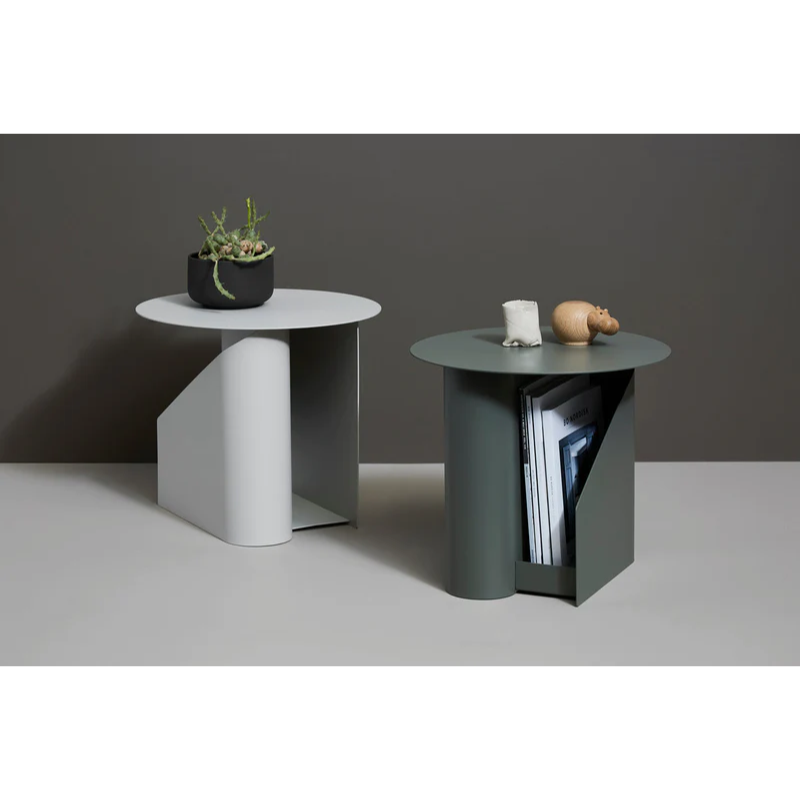 The Sentrum side table follows the principle of simplicity as it has been stripped from all unnecessary elements. What is left is a strong base and geometrical expression with pure functionalities. The S-shaped construction makes the center of attention and creates two spaces for storage on both sides to enhance the usability of the side table - ideal for magazines and books.