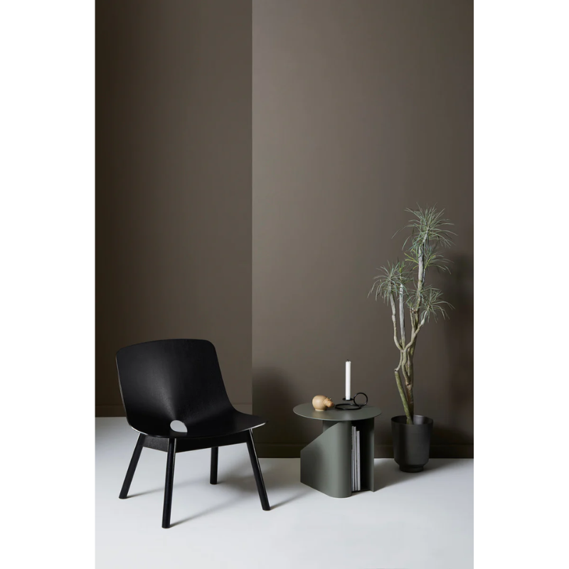 The Sentrum side table follows the principle of simplicity as it has been stripped from all unnecessary elements. What is left is a strong base and geometrical expression with pure functionalities. The S-shaped construction makes the center of attention and creates two spaces for storage on both sides to enhance the usability of the side table - ideal for magazines and books.