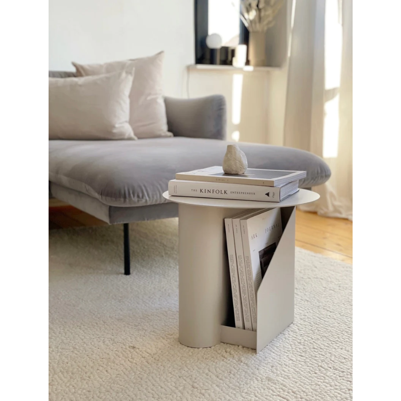 The Sentrum side table follows the principle of simplicity as it has been stripped from all unnecessary elements. What is left is a strong base and geometrical expression with pure functionalities. The S-shaped construction makes the center of attention and creates two spaces for storage on both sides to enhance the usability of the side table - ideal for magazines and books.