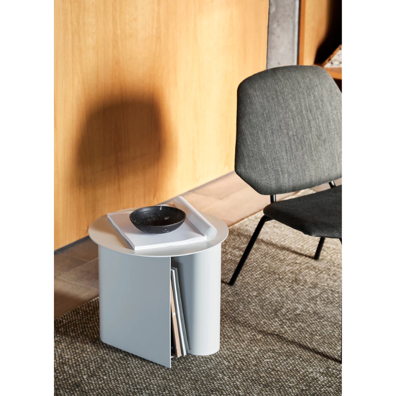 The Sentrum side table follows the principle of simplicity as it has been stripped from all unnecessary elements. What is left is a strong base and geometrical expression with pure functionalities. The S-shaped construction makes the center of attention and creates two spaces for storage on both sides to enhance the usability of the side table - ideal for magazines and books.