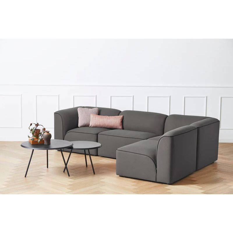 Two Soround Coffee Tables in black ash from Woud in a lounge area.