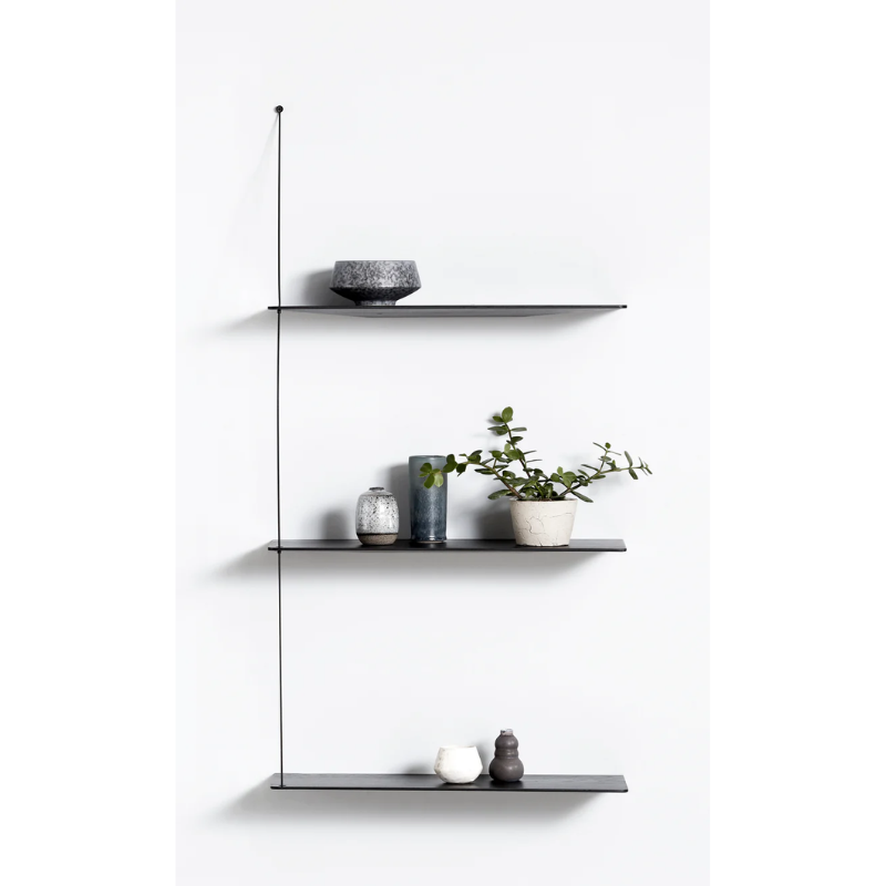 Stedge is all about lightness, purism and a clear structure. The subtle design is an optical illusion as the solid shelves seem to hang by a thread. With its light expression and fine edges, Stedge will be a perfect match for any room. Extend the shelving system with more shelves and choose either a long or short top wire to make it a perfect fit on your wall. Available in two widths.