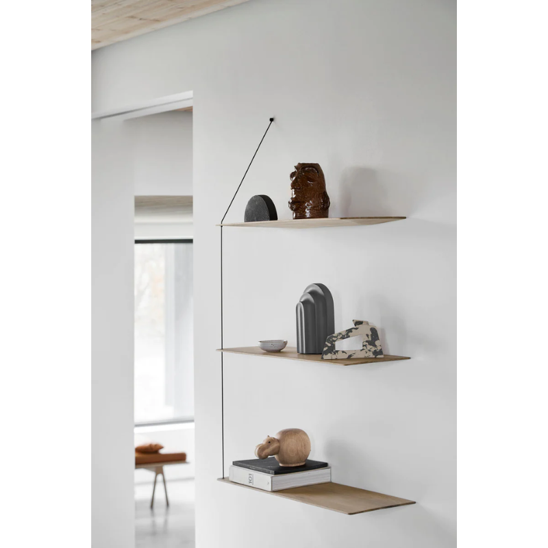 Stedge is all about lightness, purism and a clear structure. The subtle design is an optical illusion as the solid shelves seem to hang by a thread. With its light expression and fine edges, Stedge will be a perfect match for any room. Extend the shelving system with more shelves and choose either a long or short top wire to make it a perfect fit on your wall. Available in two widths.