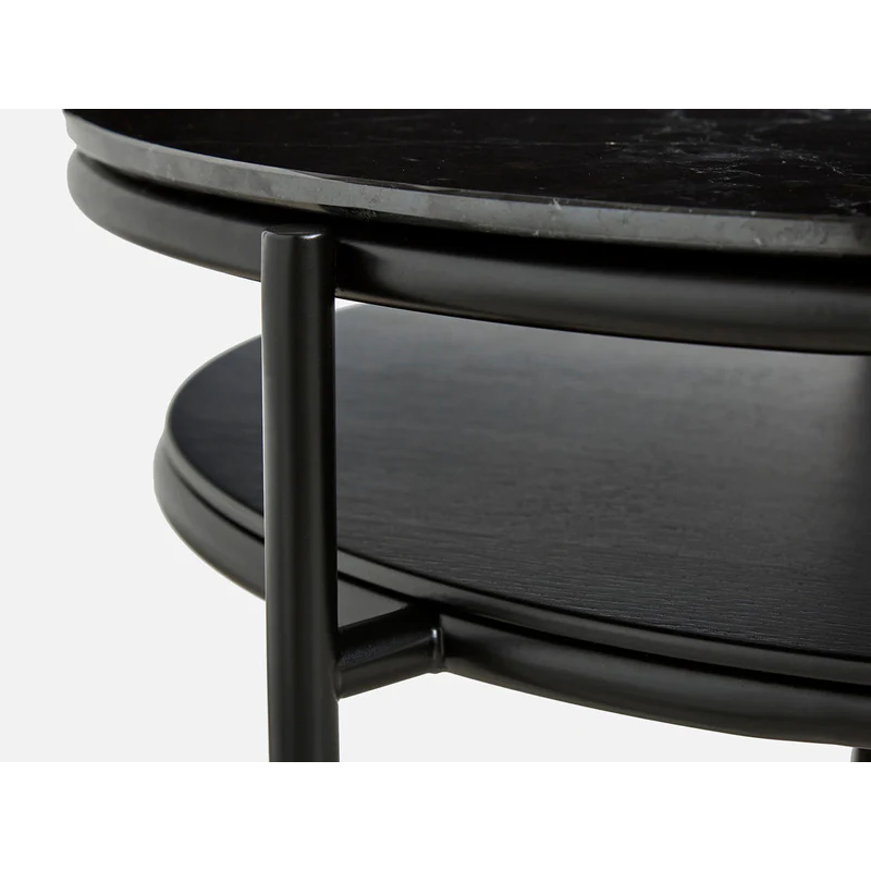 The elegant lines from the Verde mirror have been transferred to a coffee table. The oval-shaped metal construction is designed with two tabletops. The lower in black painted oak veneer and the circular top in marble. The space created between the two tabletops is ideal for flowers and plants, which has been the central idea for designer Rikke Frost when drawing the lines for the Verde series.