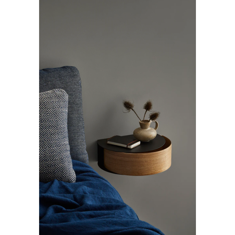 Wallie beautifully combines bent walnut with solid black metal creating an elegant wall-mounted drawer. With its circular, soft shapes Wallie is a visually strong design that easily can act as a centerpiece or be combined with other designs. The bracket embraces the magnetic wood drawer making the design both minimalistic and functional. Wallie is perfect for storing small everyday essentials in the hallway or as a bedside table in the bedroom.