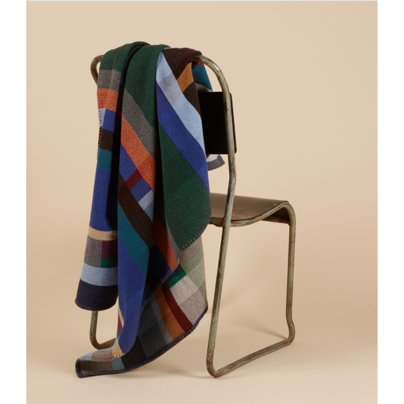 The Antoni Throw from the Wallace & Sewell Block Throw Collection is inspired by Korean artist, Chung Eun Mo's abstract paintings. This stunning throw features a bold checkerboard pattern of juxtaposed blocks and striking hues. Made from sumptuous merino lambswool and finished with blanket stitches for added elegance, the Antoni Throw is reversible with a different colorway on each side.