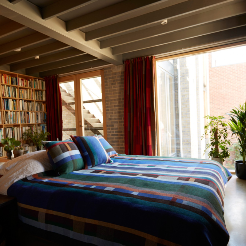 The Antoni Throw from the Wallace & Sewell Block Throw Collection is inspired by Korean artist, Chung Eun Mo's abstract paintings. This stunning throw features a bold checkerboard pattern of juxtaposed blocks and striking hues. Made from sumptuous merino lambswool and finished with blanket stitches for added elegance, the Antoni Throw is reversible with a different colorway on each side.