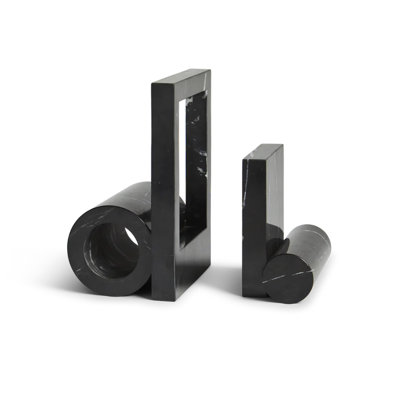 The Booknd from Woud, a solid marble bookend, in black.
