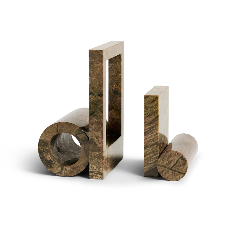 The Booknd from Woud, a solid marble bookend, in brown.