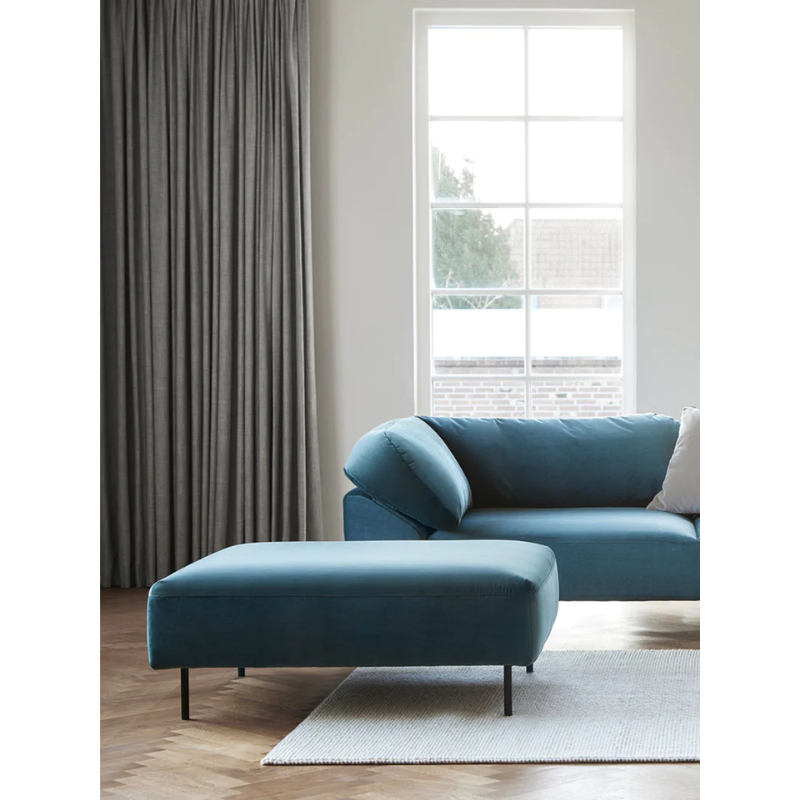 The Collar Ottoman from Woud in a living room.