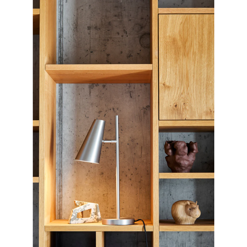 The Cono Table Lamp from Woud in a living area.