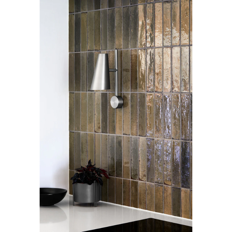 The Cono Wall Lamp from Woud in a bathroom.